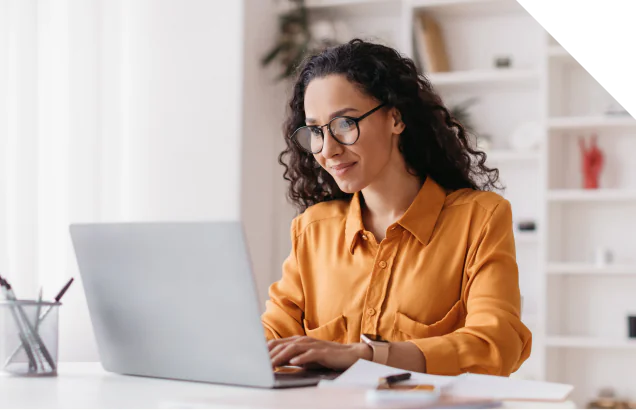 An Isograd employee working remotely from a laptop